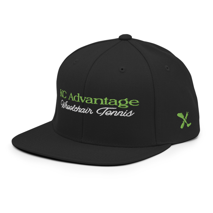 Front left angle of the MAS Kansas City Advantage Wheelchair Tennis Script Black Flat Bill Snapback against a white background