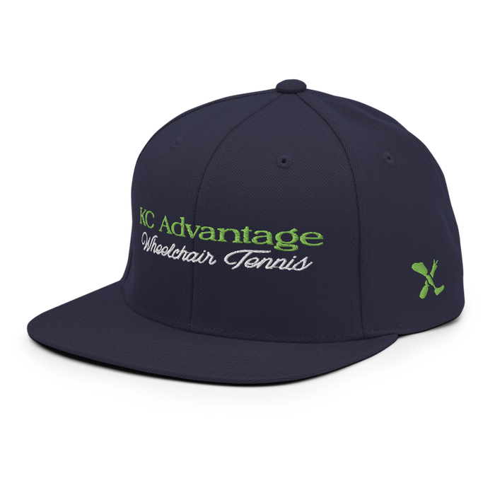 Front left angle of the MAS Kansas City Advantage Wheelchair Tennis Script Navy Flat Bill Snapback against a white background