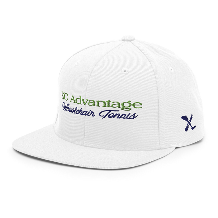 Front left angle of the MAS Kansas City Advantage Wheelchair Tennis Script White Flat Bill Snapback against a white background