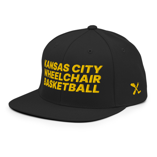 Front left angle of the MAS Kansas City Kings Wheelchair Basketball Black Flat Bill Snapback against a white background