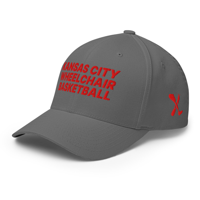 Front left angle of the MAS Kansas City Kings Wheelchair Basketball Grey Flexfit Curved Bill Fitted against a white background