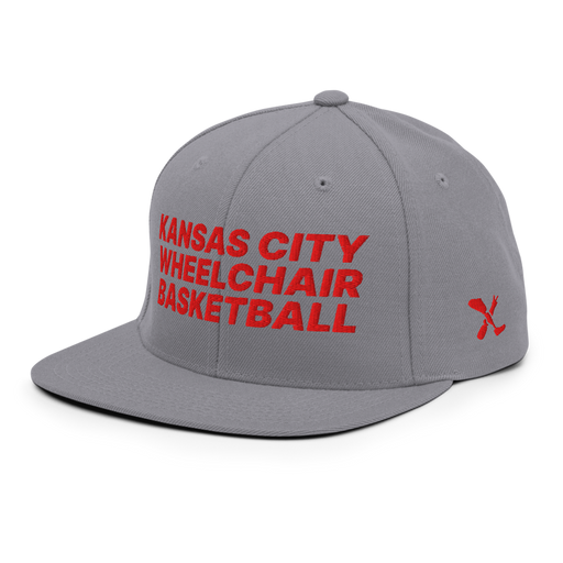 Front left angle of the MAS Kansas City Kings Wheelchair Basketball Silver Flat Bill Snapback against a white background