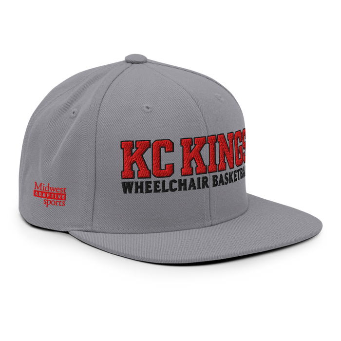Front right angle of the MAS Kansas City Kings Wheelchair Basketball KC Kings Silver Flat Bill Snapback against a white background