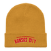 Front angle of the MAS Kansas City Wheelchair Football Arch Mustard Yellow Organic Beanie laid flat against a white background