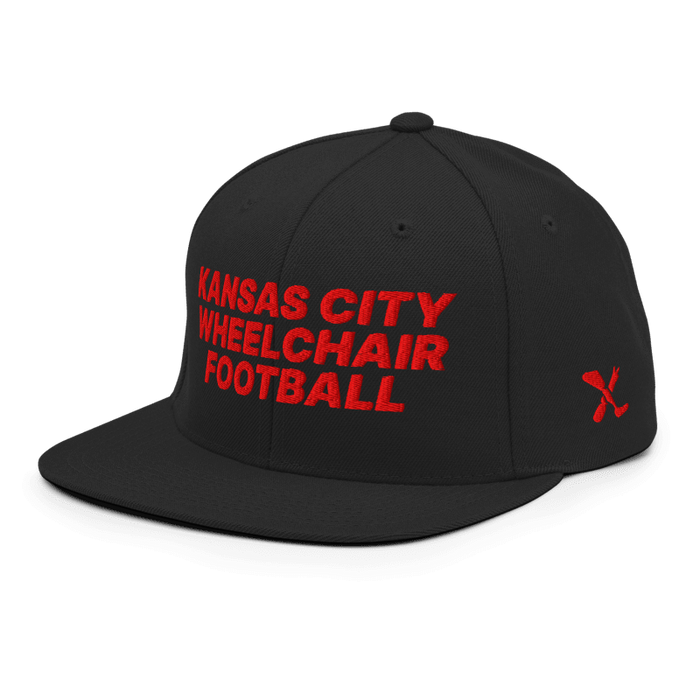 Front left angle of the MAS Kansas City Wheelchair Football Black & Red Flat Bill Snapback against a white background