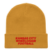 Front angle of the MAS Kansas City Wheelchair Football Mustard Yellow & Red Organic Beanie laid flat against a white background