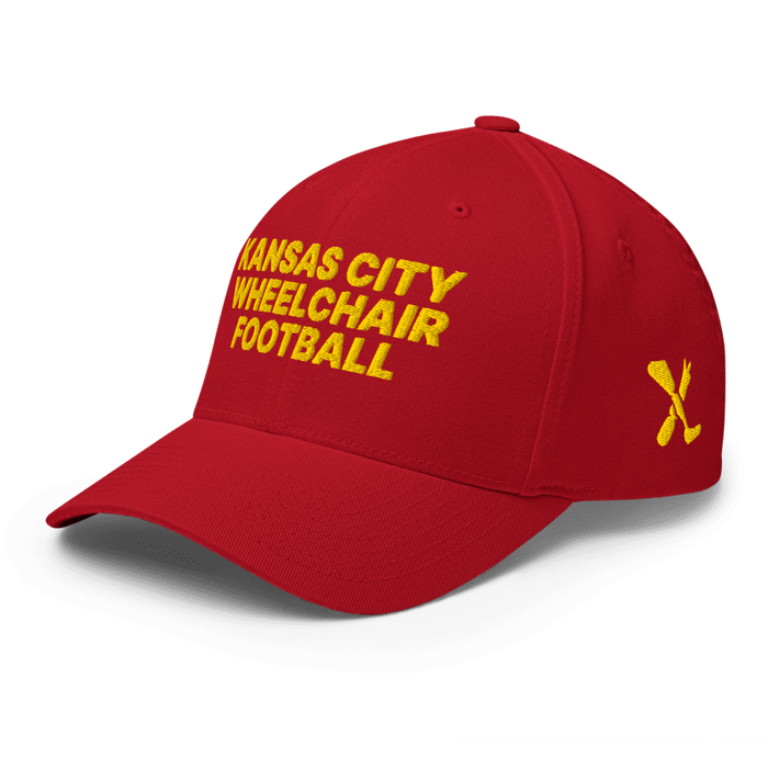 Front left angle of the MAS Kansas City Wheelchair Football Red & Gold Flexfit Curved Bill Fitted against a white background