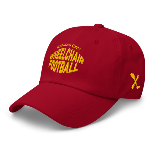 Front left angle of the MAS Kansas City Wheelchair Football Warp Cranberry & Gold Dad Hat against a white background