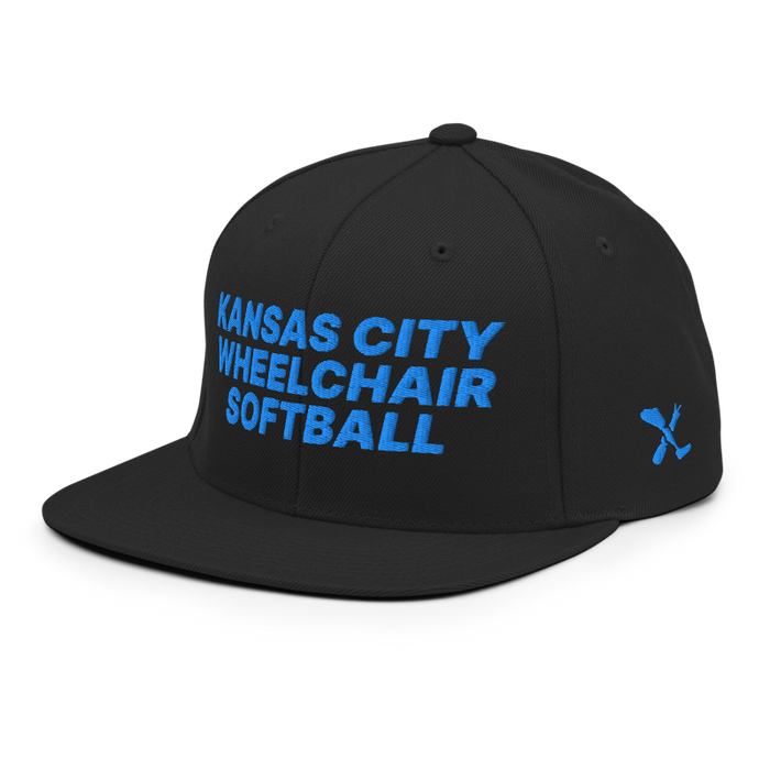 Front left angle of the MAS Kansas City Wheelchair Softball Black Flat Bill Snapback against a white background