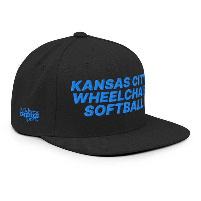Front right angle of the MAS Kansas City Wheelchair Softball Black Flat Bill Snapback against a white background