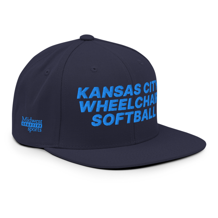 Front right angle of the MAS Kansas City Wheelchair Softball Navy Flat Bill Snapback against a white background