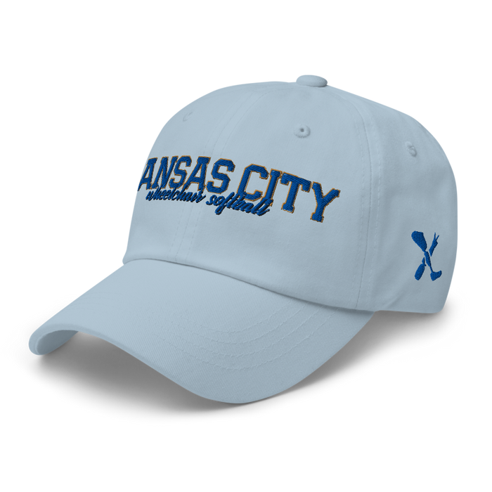 Front left angle of the MAS Kansas City Wheelchair Softball Script Light Blue Dad Hat against a white background