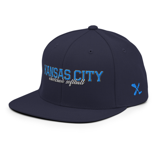 Front left angle of the MAS Kansas City Wheelchair Softball Script Navy Flat Bill Snapback against a white background