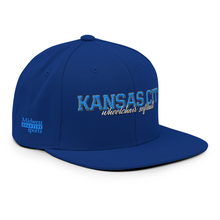 Front right angle of the MAS Kansas City Wheelchair Softball Script Royal Blue Flat Bill Snapback against a white background