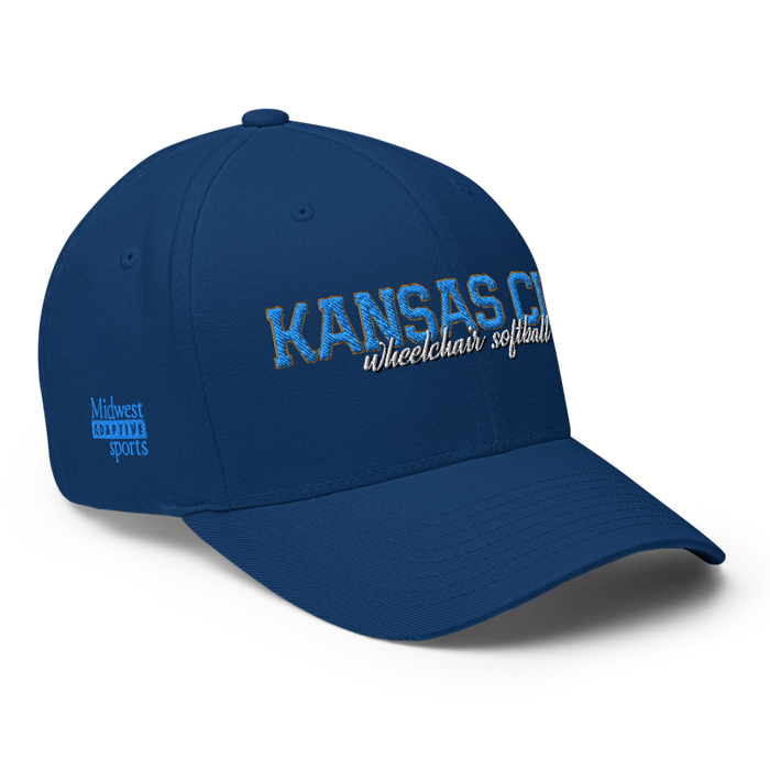 Front right angle of the MAS Kansas City Wheelchair Softball Script Royal Blue Flexfit Curved Bill Fitted against a white background