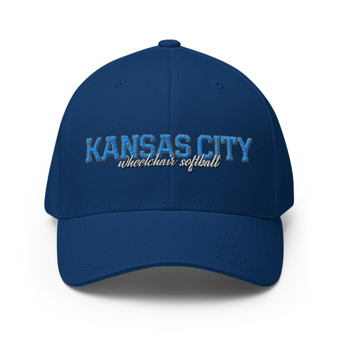 Front angle of the MAS Kansas City Wheelchair Softball Script Royal Blue Flexfit Curved Bill Fitted against a white background
