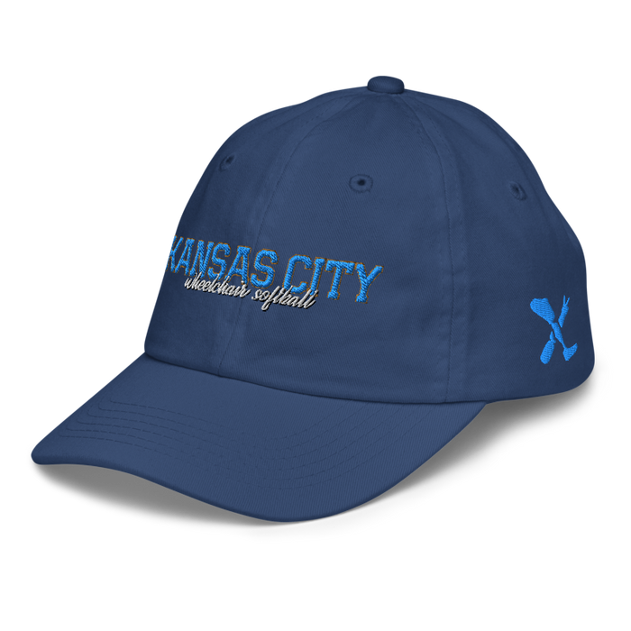 Front left angle of the MAS Kansas City Wheelchair Softball Script Royal Youth Dad Hat against a white background