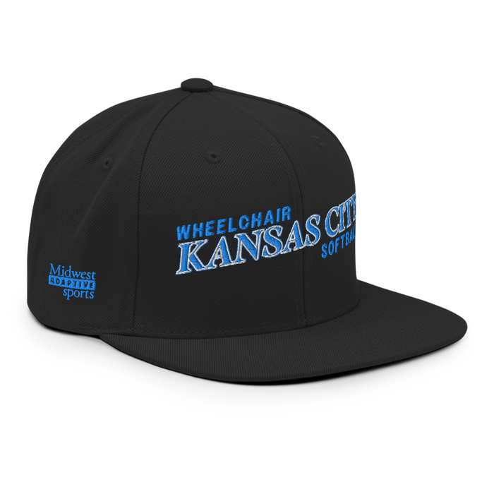 Front right angle of the MAS Kansas City Wheelchair Softball Slant Black Flat Bill Snapback against a white background