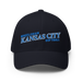 Front angle of the MAS Kansas City Wheelchair Softball Slant Dark Navy Flexfit Curved Bill Fitted against a white background