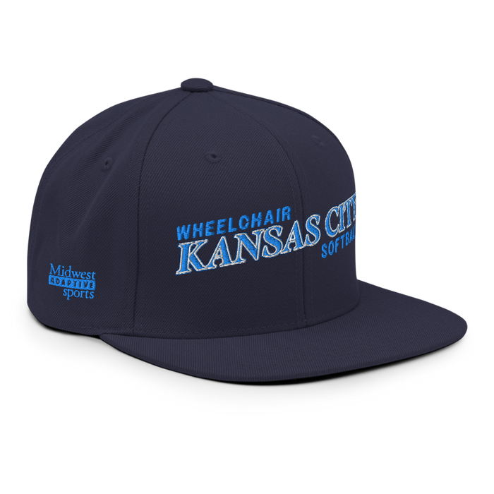 Front right angle of the MAS Kansas City Wheelchair Softball Slant Navy Flat Bill Snapback against a white background