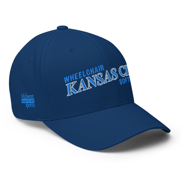 Front right angle of the MAS Kansas City Wheelchair Softball Slant Royal Blue Flexfit Curved Bill Fitted against a white background