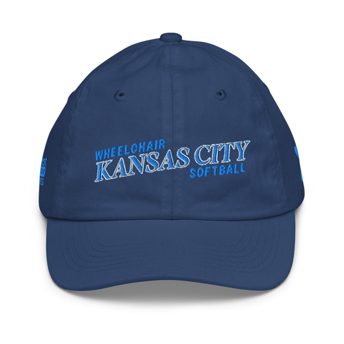 Front angle of the MAS Kansas City Wheelchair Softball Slant Royal Youth Dad Hat against a white background