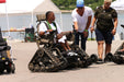 MAS Day at the Lake participant riding in a track chair while interacting with community members 