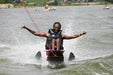MAS Day at the Lake adaptive water ski participant smiling and giving two thumbs up while on Smithville Lake