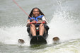 MAS Day at the Lake participant enjoying water skiing while being pulled from a boat with water wakes behind them at Smithville Lake