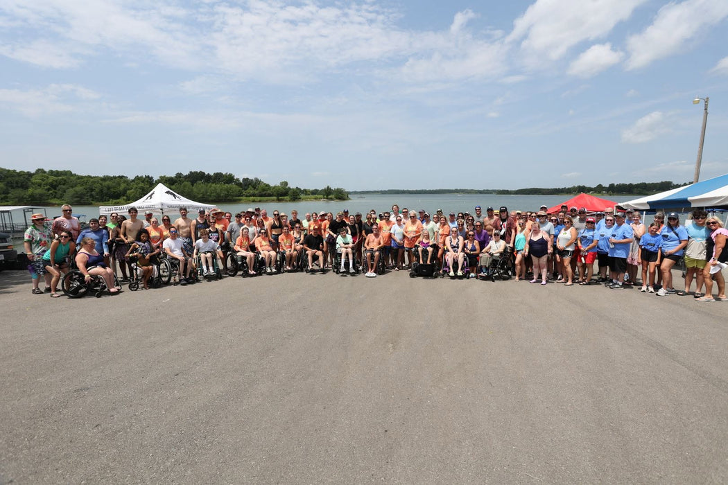 MAS Day at the Lake volunteers and participants on the water at the annual adaptive watersports clinic
