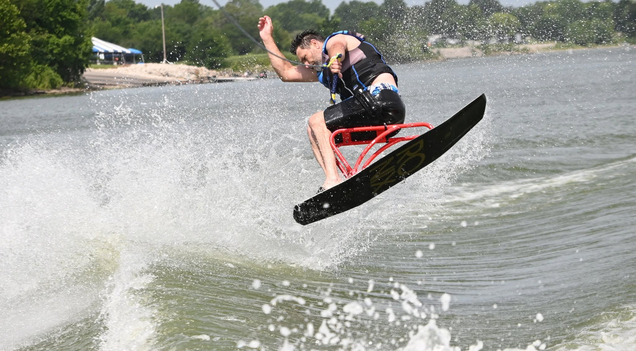 MAS Day at the Lake participant water skiing and getting air off a wake at Smithville Lake during the annual adaptive watersports clinic
