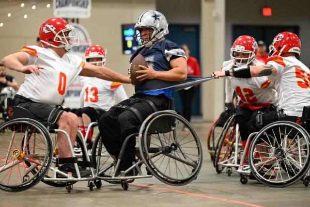 MAS Kansas City Chiefs defenders tackling an offensive player