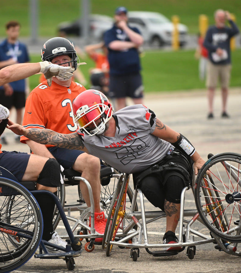 MAS Kansas City Chiefs defender and Team Amplife® Ambassador Jason Loftiss reaching for the quaterback