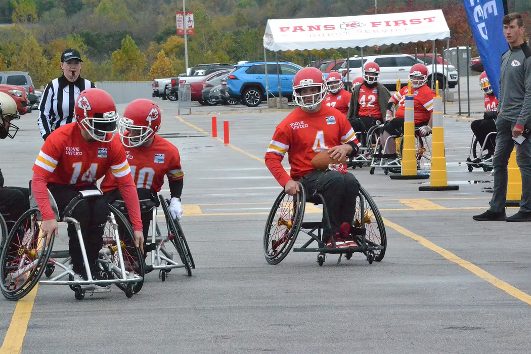MAP Kansas City Chief's quarterback rolling out to the edge, as blockers set the edge