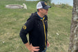 Person wearing the MagZip Adaptive Lightweight Hoodie with Magnetic Zipper outdoors