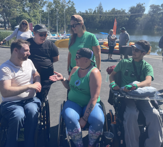 NorCal SCI participants talking between each other at Vasona Lake.