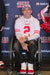Man in a wheelchair wearing a San Francisco 49ers jersey.