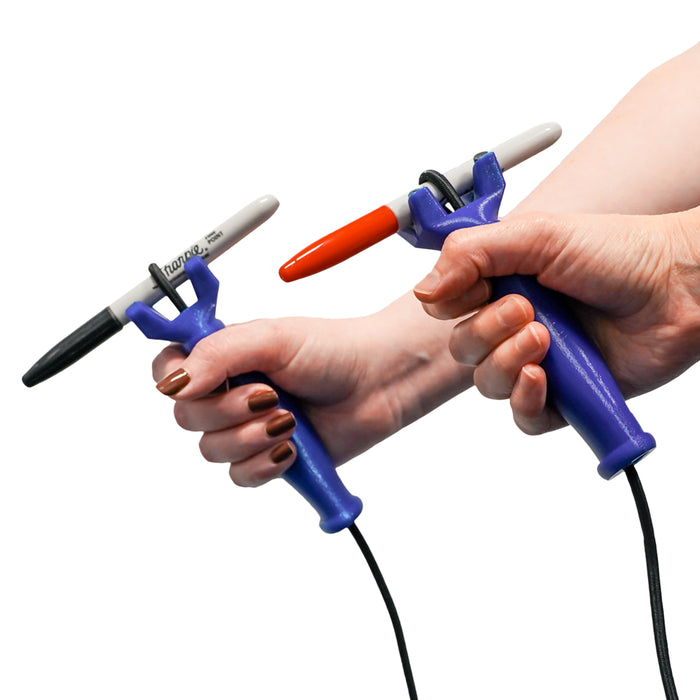 2 hands each holding the functionalhand Universal Cuff Grip Aid with a marker being held on a white background