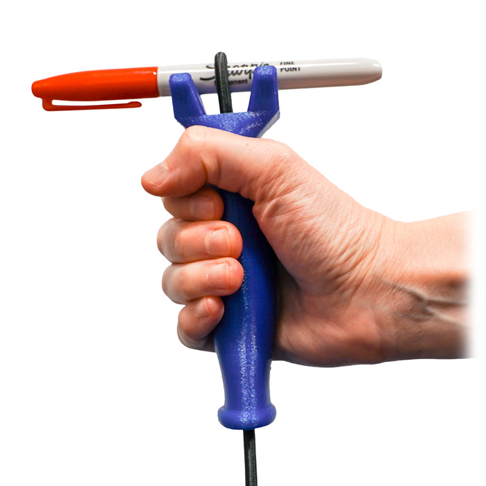 Hand holding the functionalhand Universal Cuff Grip Aid with a marker being held on a white background