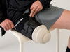 Detail of a user putting on the Ethnocare Overlay.