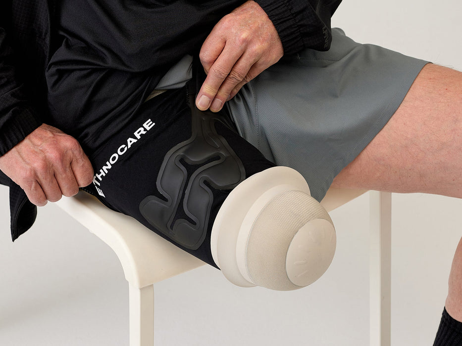Detail of a user putting on the Ethnocare Overlay.