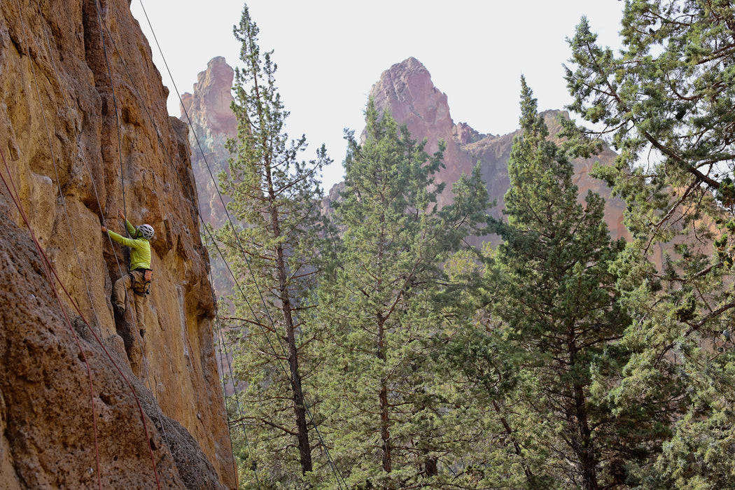 Paradox Sports climber ascending a rock wall in the Smith Rock State Park.