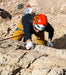 Person in climbing gear on a rocky surface