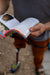 Person holding an open book.