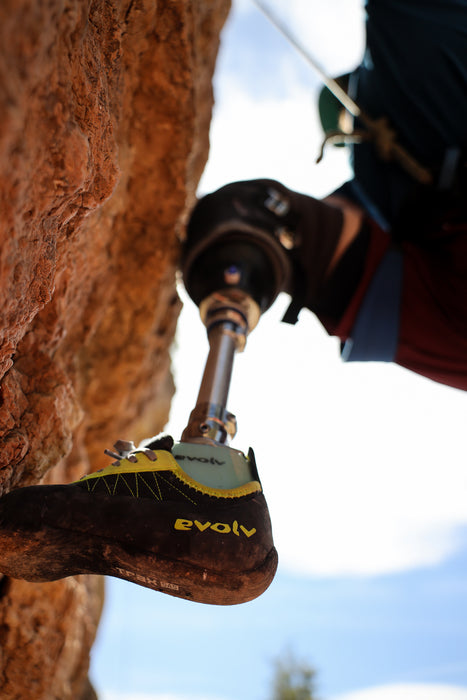 Close-up of a climbing shoe with an on a prosthetic leg.