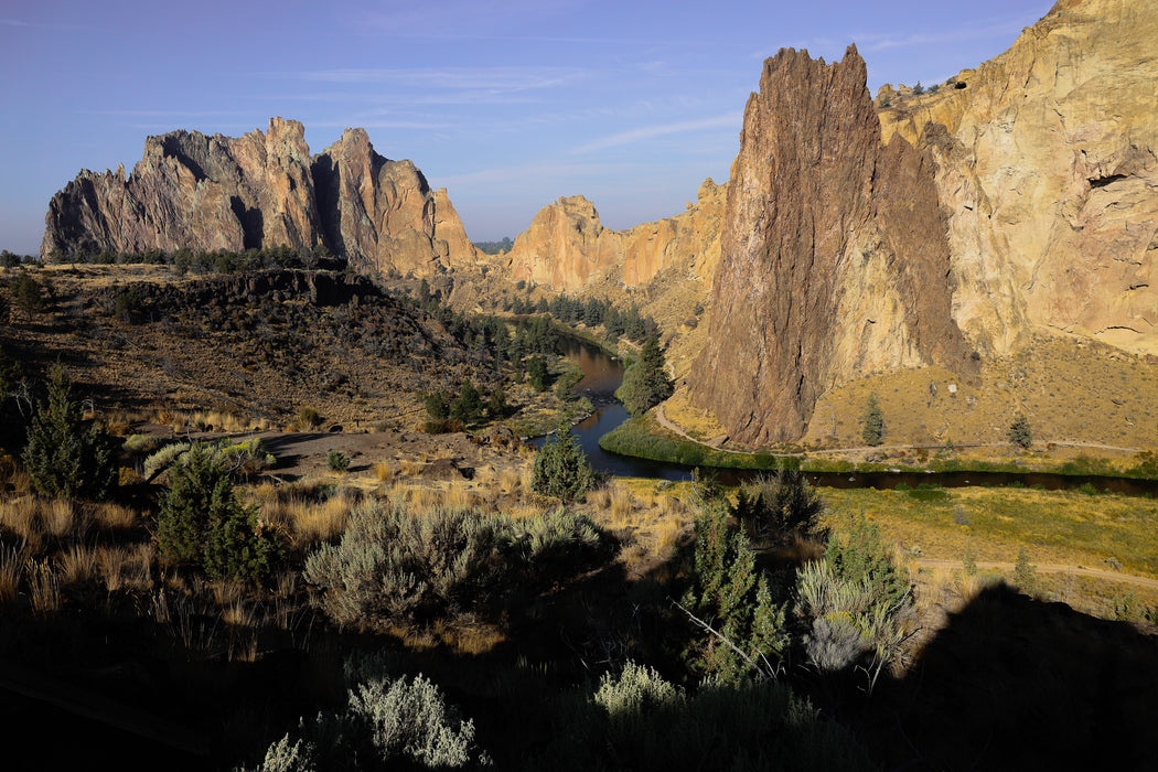 Scenic view of a river flowing through a canyon with rocky cliffs.