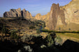 Scenic view of a river flowing through a canyon with rocky cliffs.