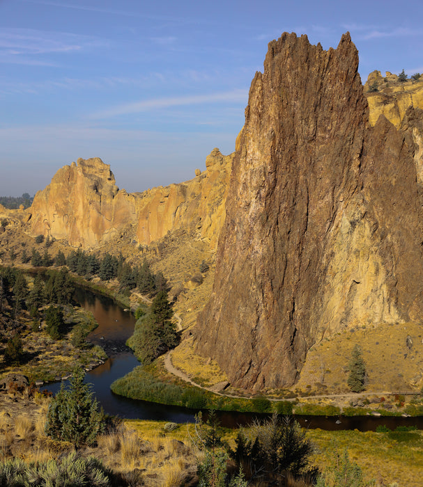 Scenic view of a river flowing through a canyon with large rock formations.