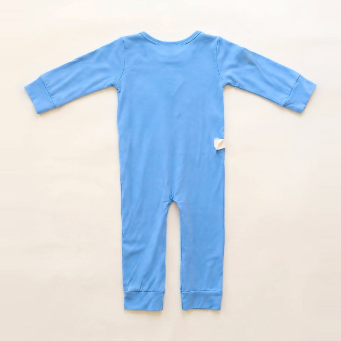 Back angle of the PediaTech Apparel LineWear Central Line Access Baby & Toddler Bodysuit in light blue (Sky Lullaby Edition) with a white tubing guide at the lower back, laid flat against an off-white background