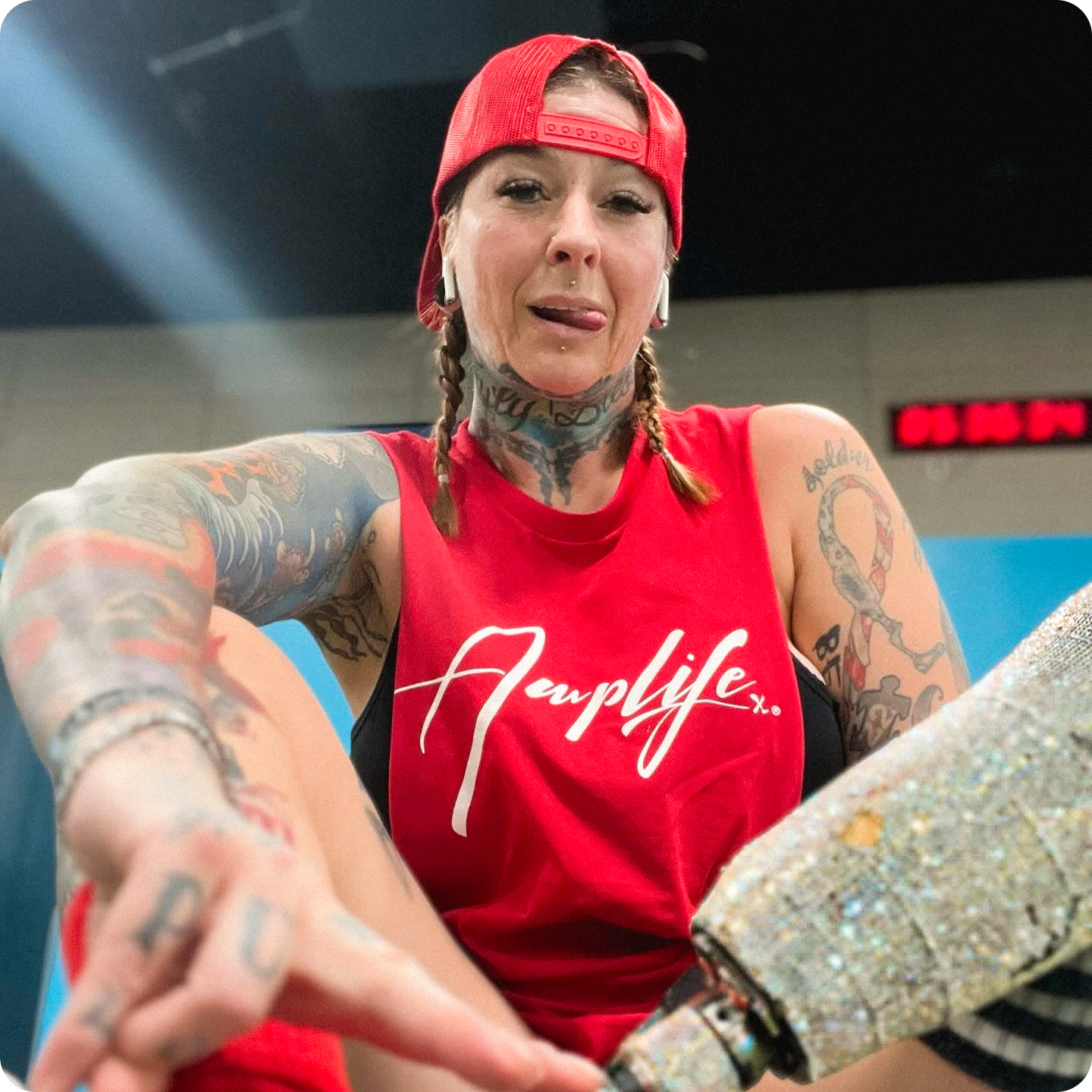 Team Amplife® Ambassador SuZanne Jacobsen wearing the Amplife® Signature T-Shirt in the gym.